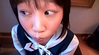 Tiny Japanese girl on knees sucking cock