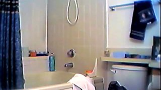 Busty woman taking a shower